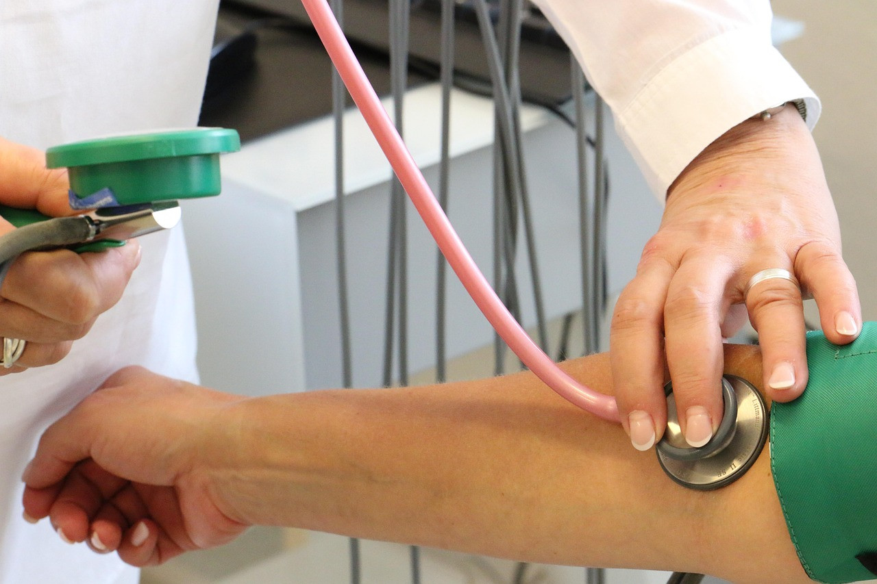 Representative image: doctor checking woman blood pressure