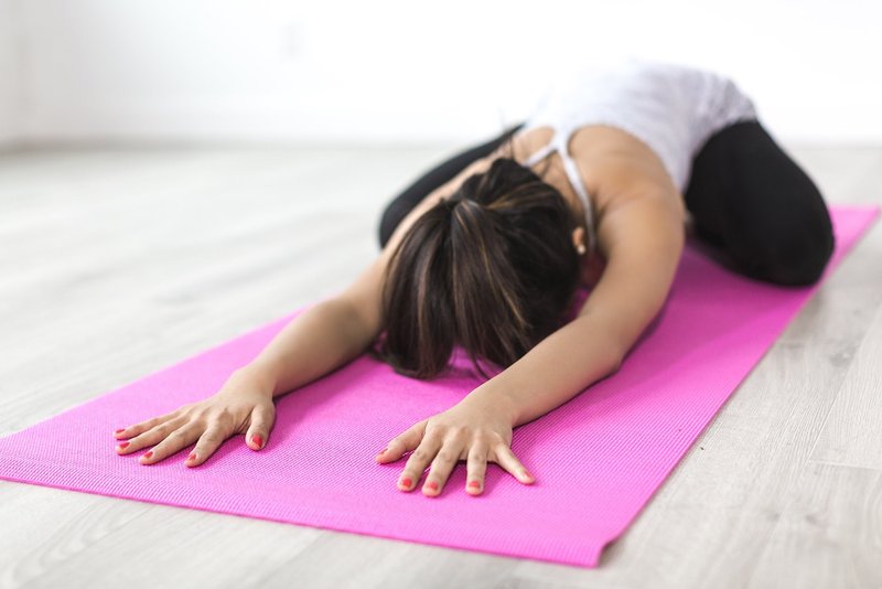 Representative image: students doing yoga on mats