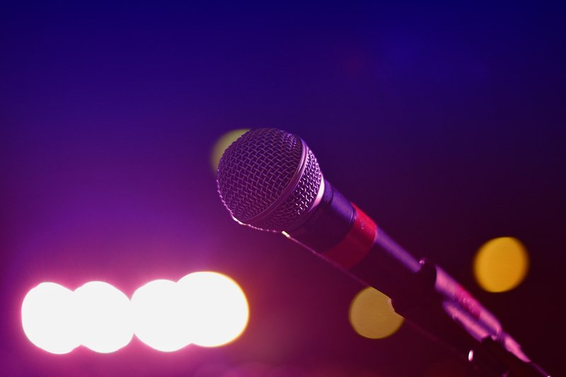 Representative image: microphone on stage spotlight
