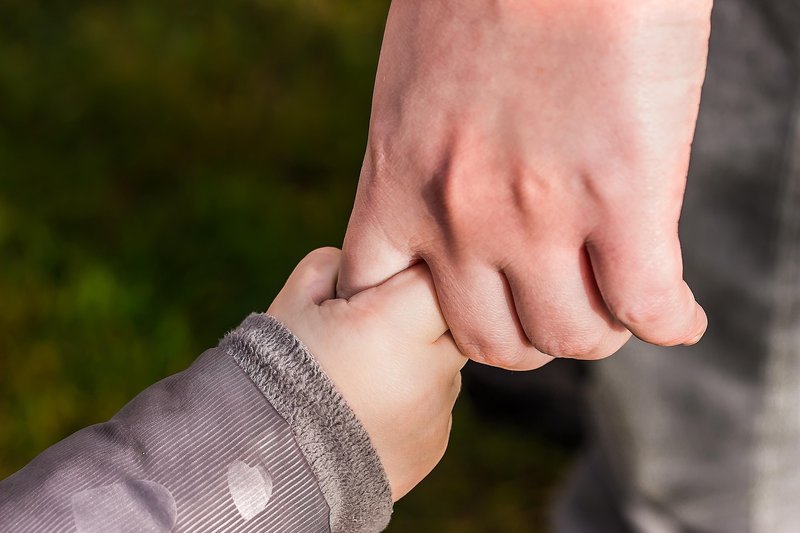 Representative image: parent holding toddler hand