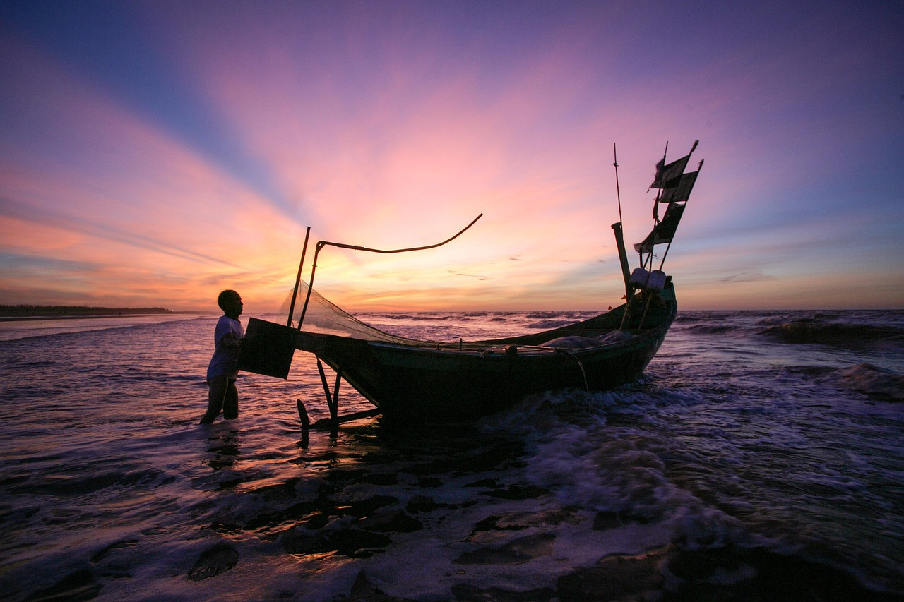 Representative image: beach sunrise fishing boats