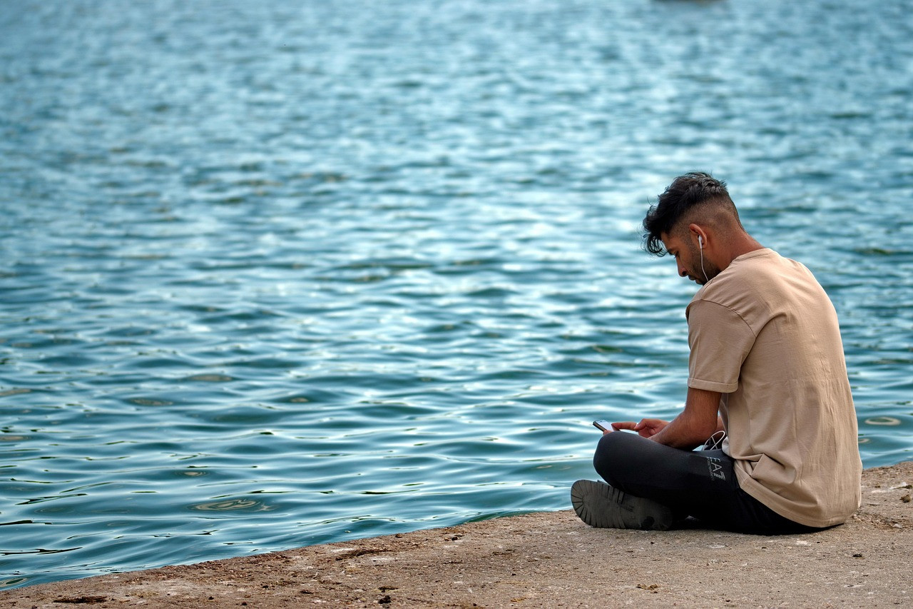 Representative image: young man using smartphone