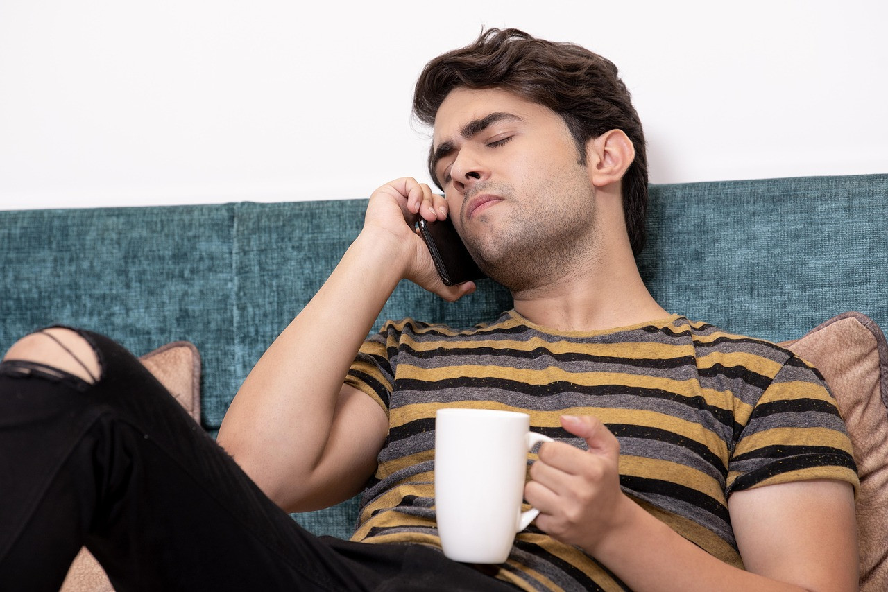 Representative image: person talking to smartphone