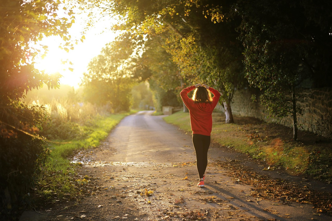 Representative image: woman walking outdoors exercise