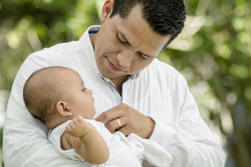Representative image: father holding newborn baby