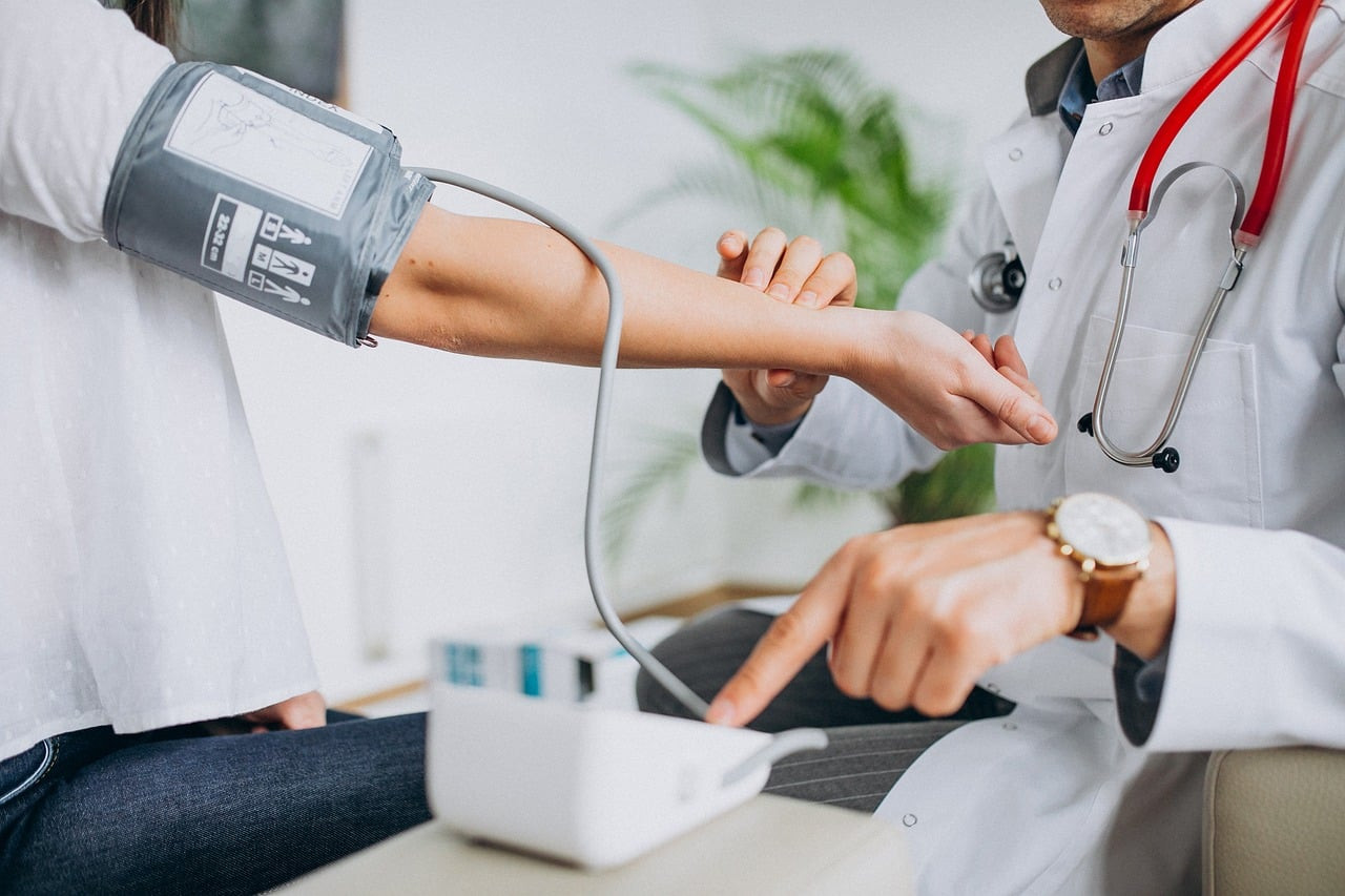 Representative image: woman doctor blood pressure check