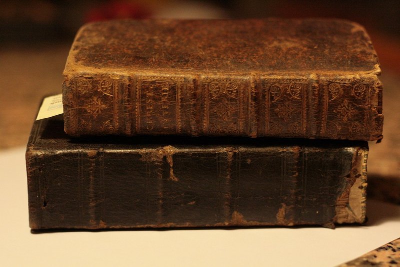 Representative image: old books stack candle
