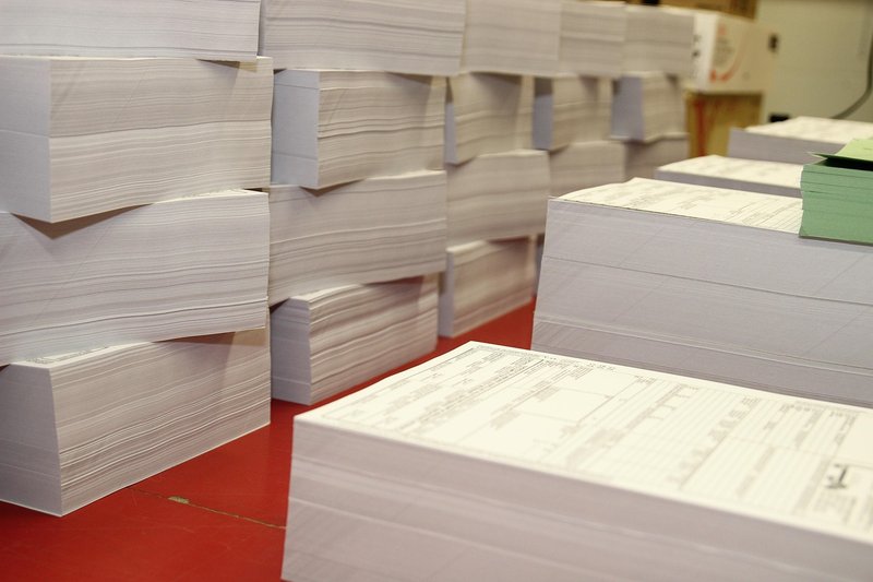 Representative image: stack of answer sheets