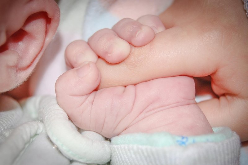 Representative image: grandfather holding child hand