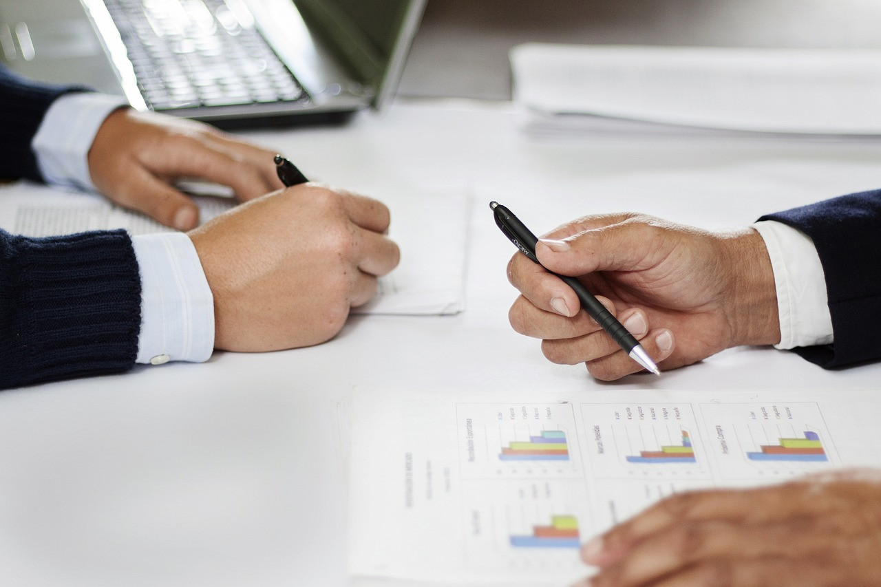 Representative image: business meeting laptop charts