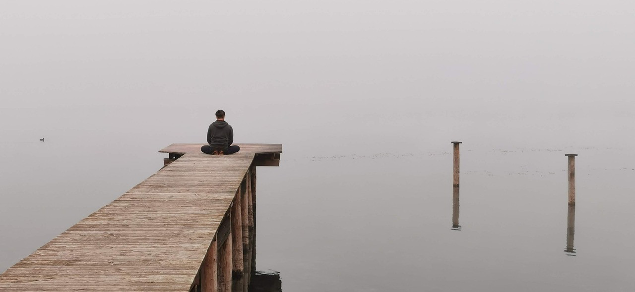 Representative image: person meditating with headphones