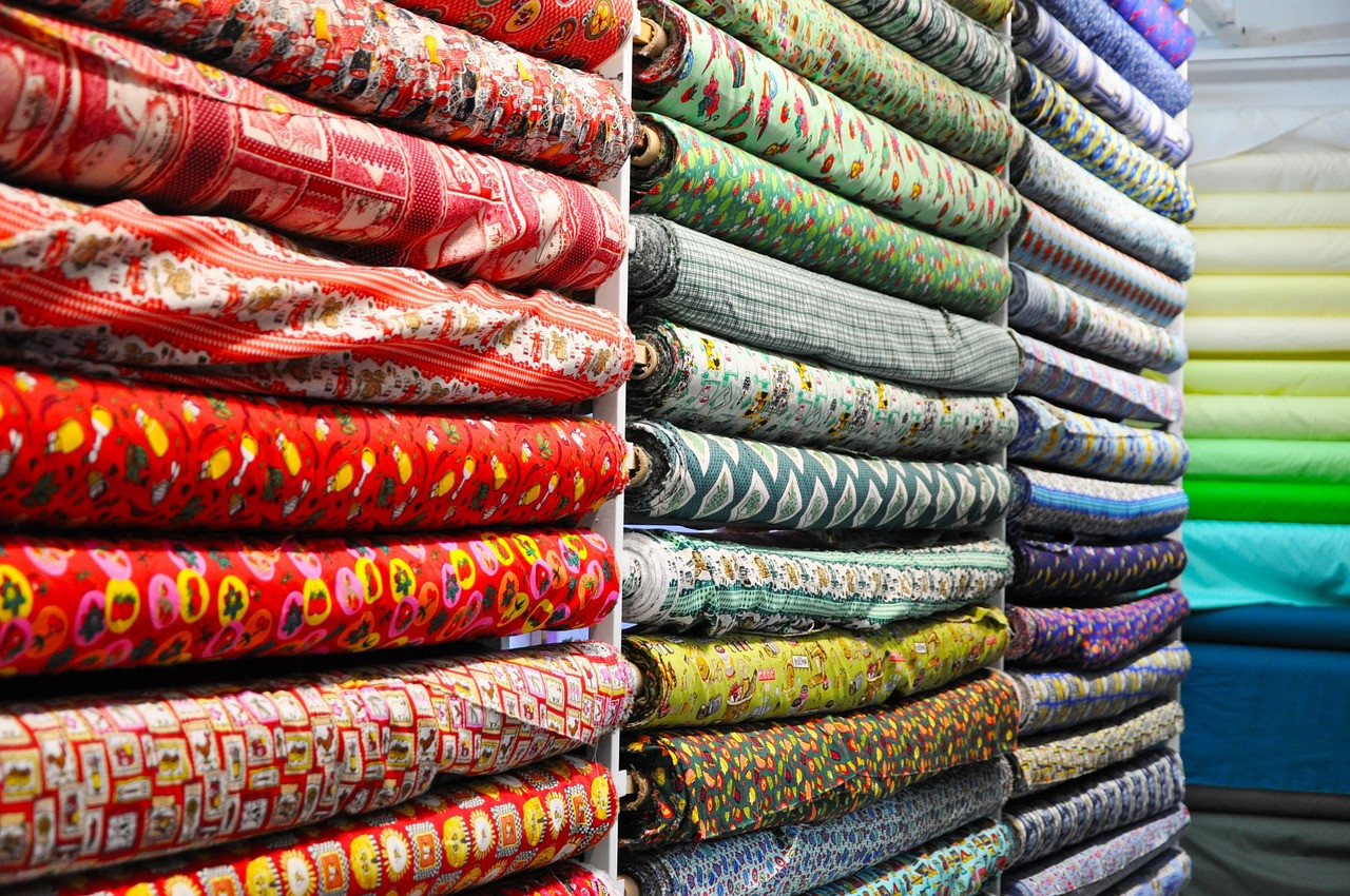Representative image: rolls of suiting fabric in shop