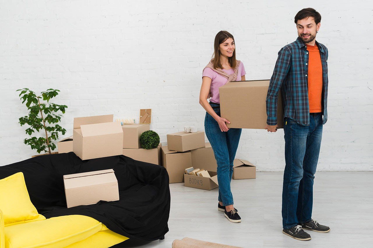 Representative image: couple packing moving boxes