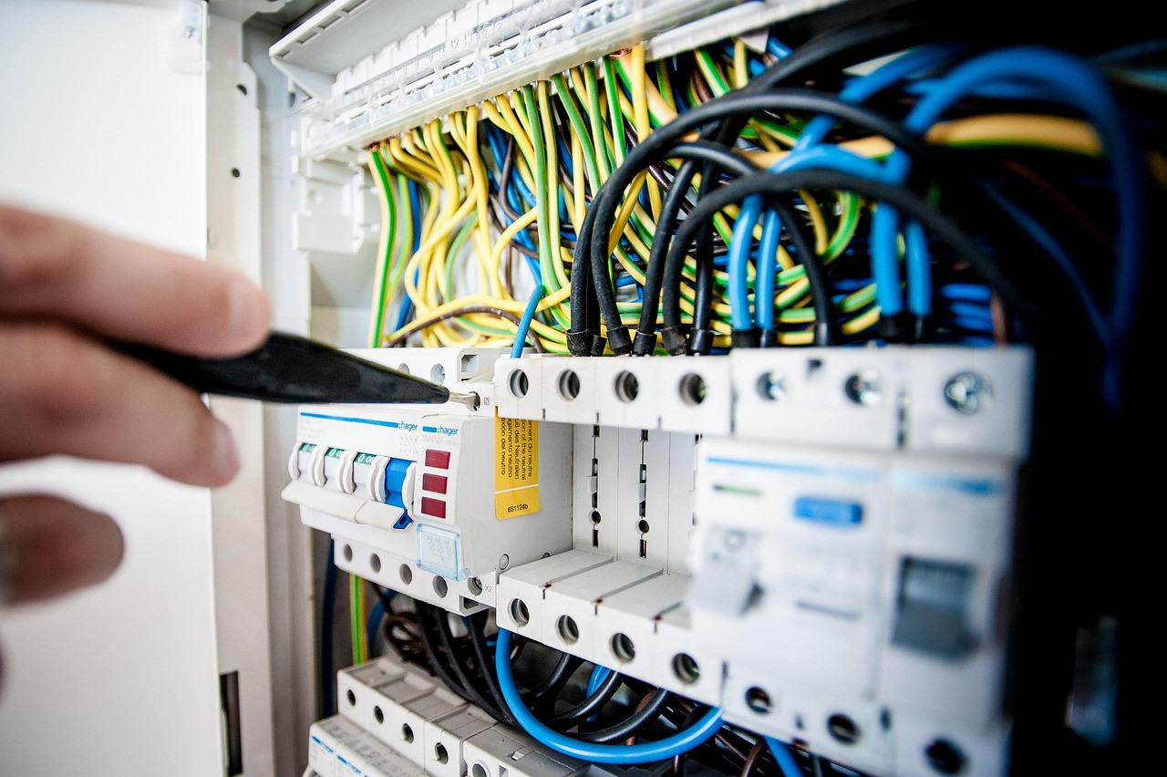 Representative image: electrician wiring switchboard