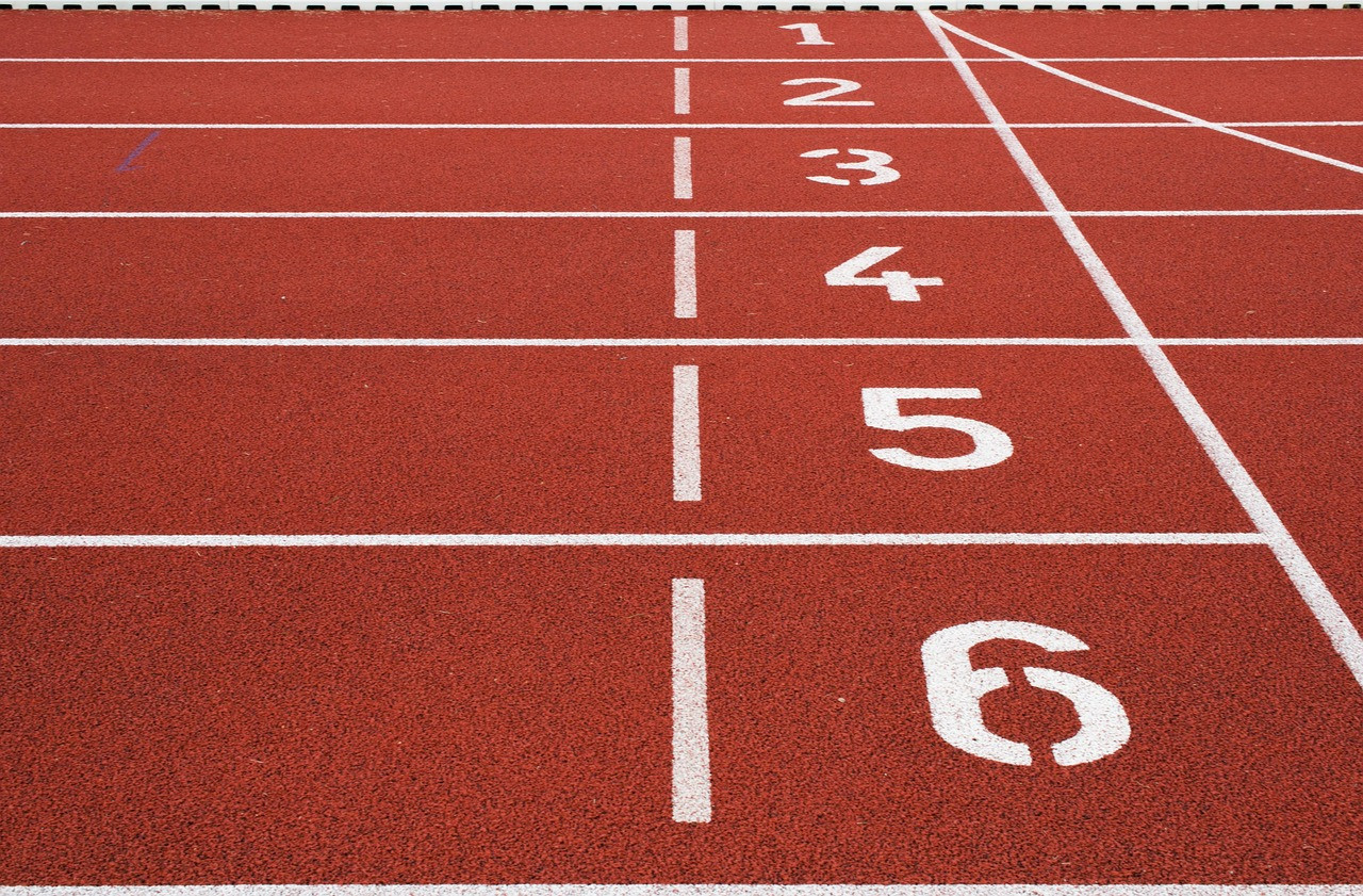 Representative image: young men running race track