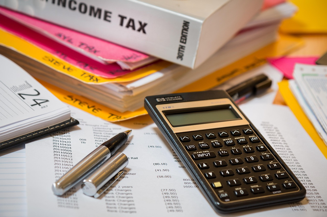 Representative image: tax form calculator pen