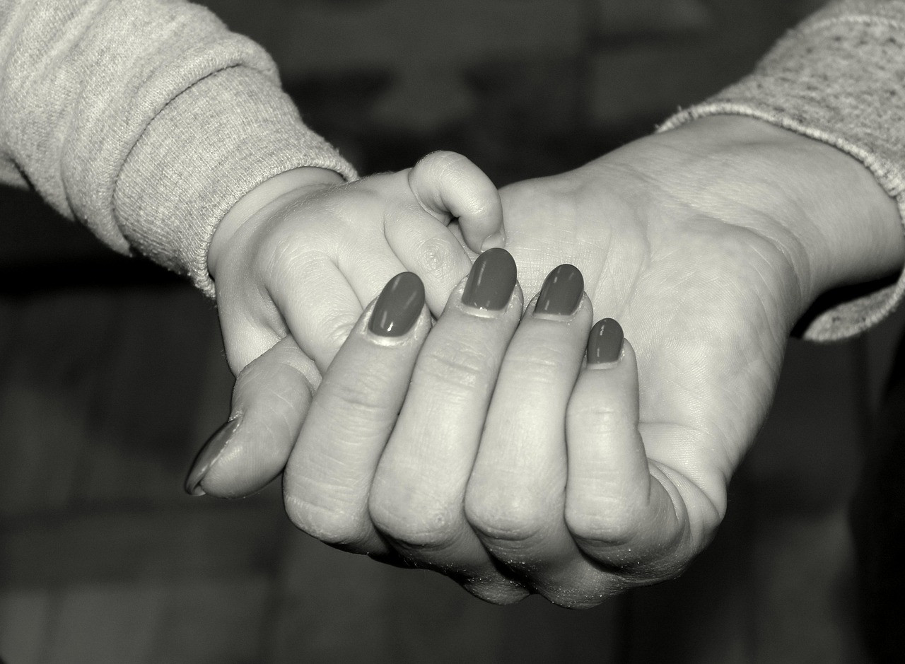 Representative image: mother holding child hand