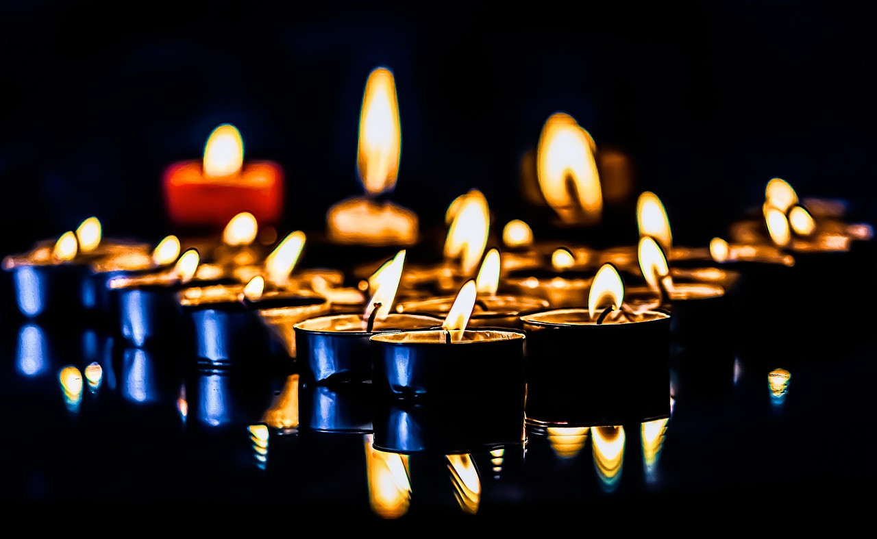 Representative image: lit candle in the dark