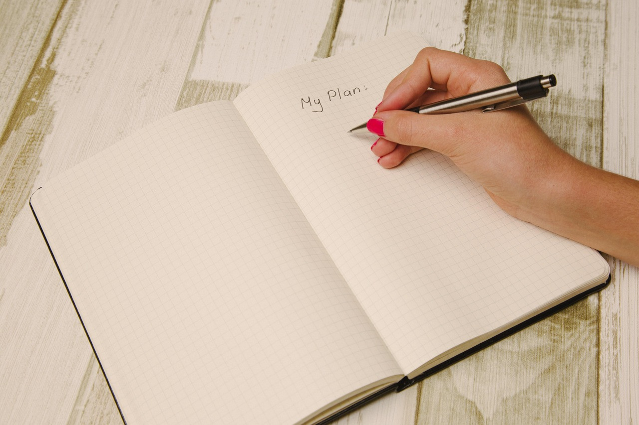 Representative image: woman writing family planner