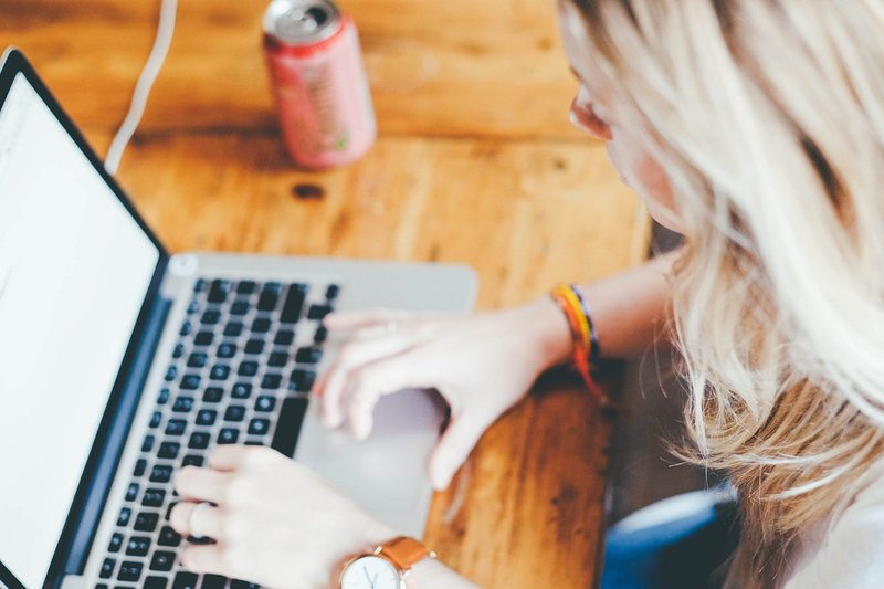 Representative image: woman working on a laptop at home