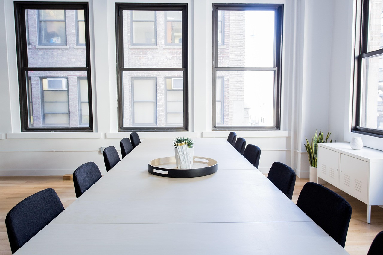 Representative image: boardroom meeting table
