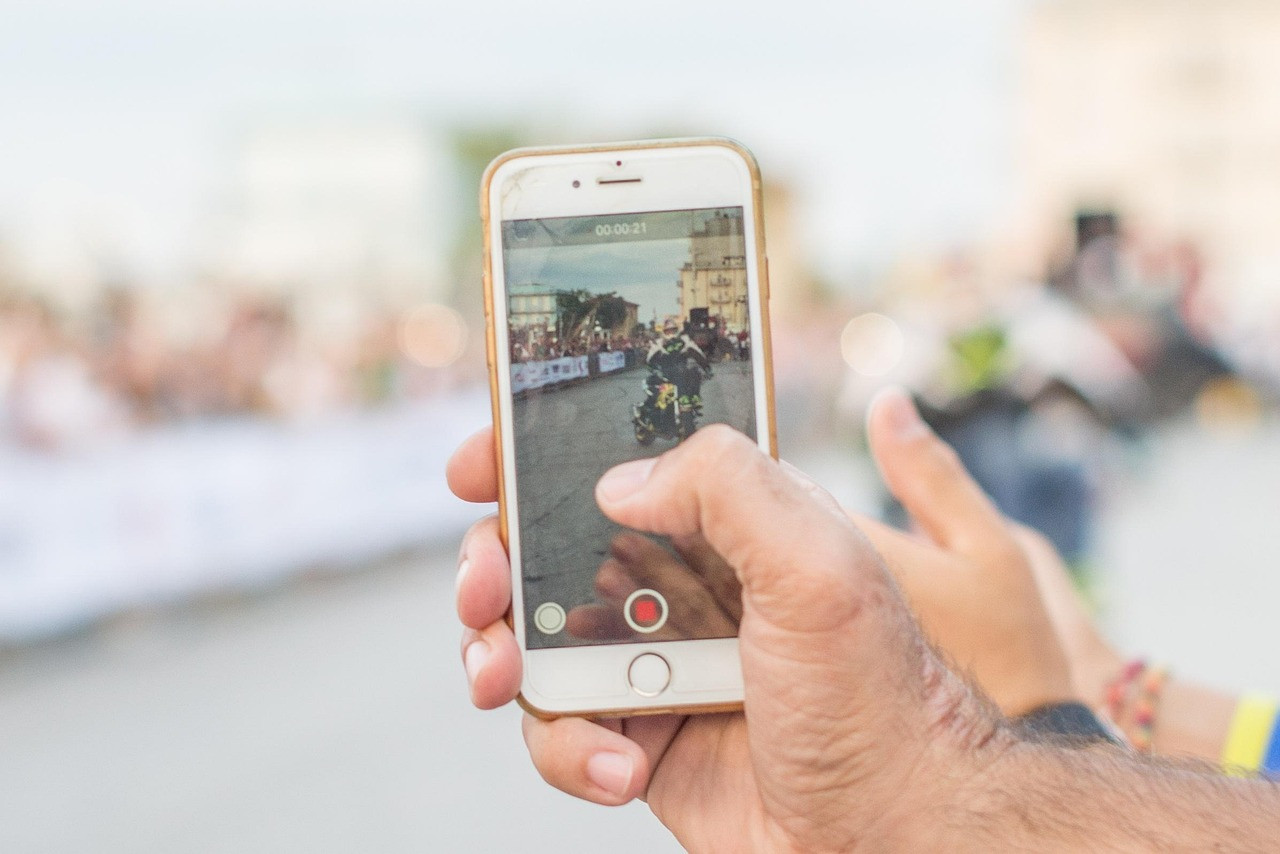 Representative image: young person recording video with phone